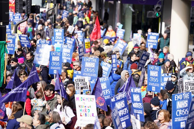 <p>People gather in London ahead of a Support the Strikes march in solidarity with nurses, junior doctors and other NHS staff</p>