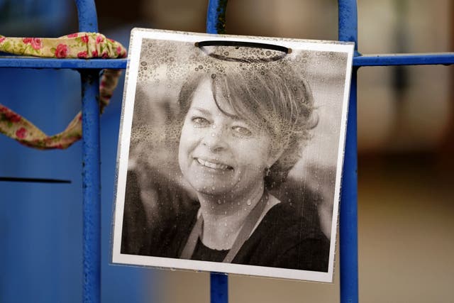 A photograph of Ruth Perry attached to the fence outside John Rankin Schools in Newbury, Berkshire (Andrew Matthews/PA)