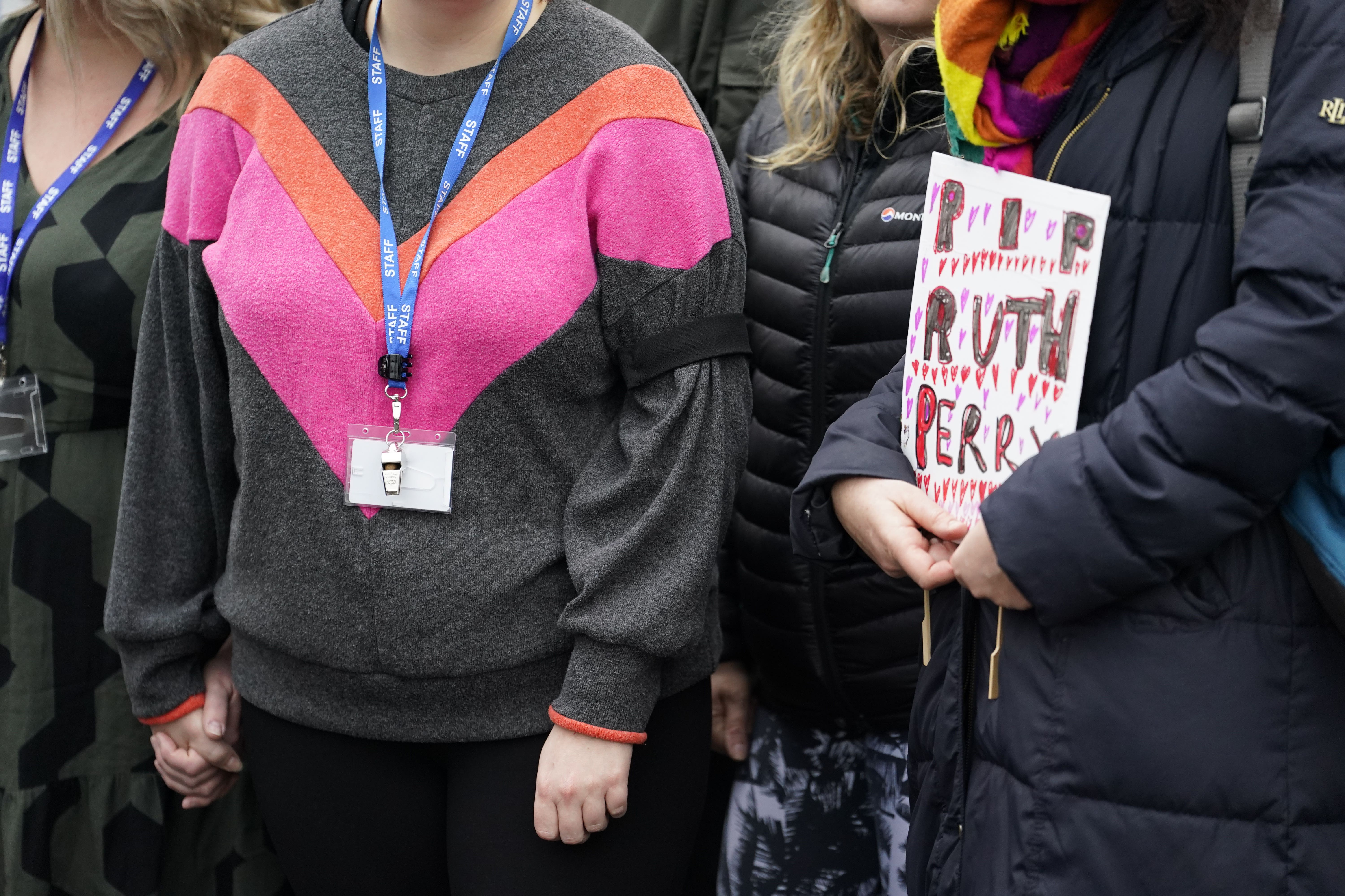 A teacher wears a black armband, in memory of Ruth Perry (Andrew Matthews/PA)
