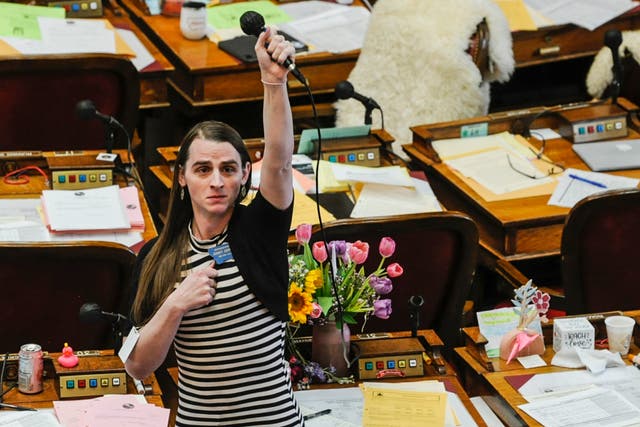 <p>Montana state Rep. Zooey Zephyr, D-Missoula, alone on the House floor stands in protest as demonstrators are arrested in the House gallery, Monday, April 24, 2023, at the state Capitol in Helena, Montana</p>