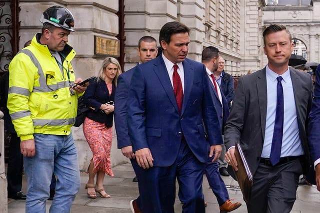 <p>Florida Republican Gov. Ron DeSantis, center, leaves the Foreign Office after visiting Britain's Foreign Secretary James Cleverly in London, Friday, April 28, 2023</p>