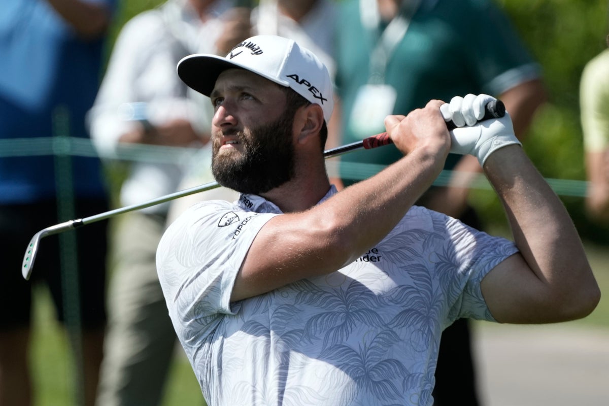 Photo of Jon Rahm shoots course record as title defence hots up