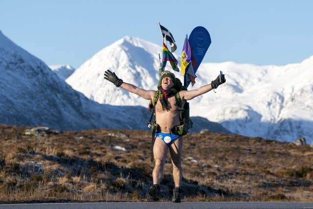 Mick Cullen, otherwise known as Speedo Mick, walks through Glencoe in sub-zero temperatures wearing only his swimming trunks during his fundraising trek (PA)