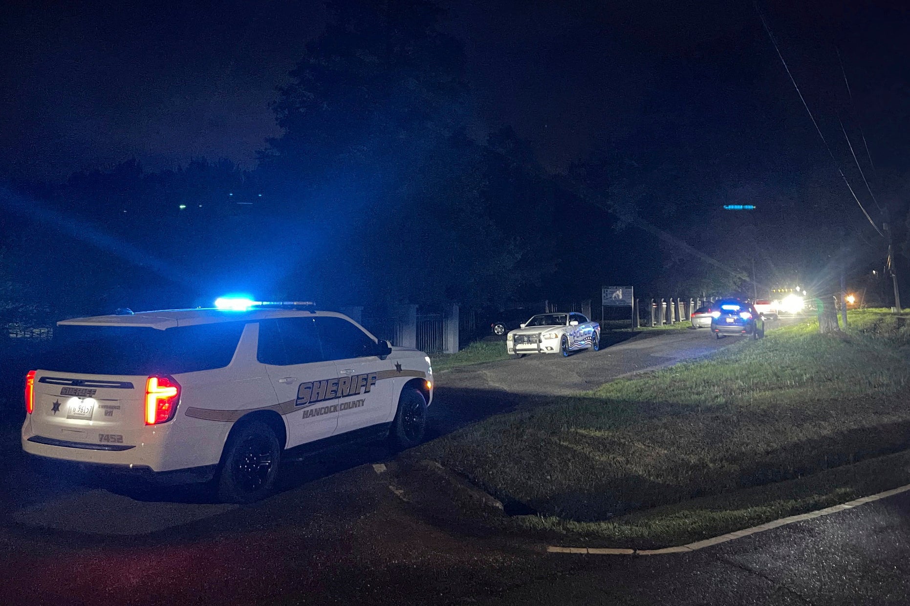 Police are pictured at the scene of the after-prom party shooting