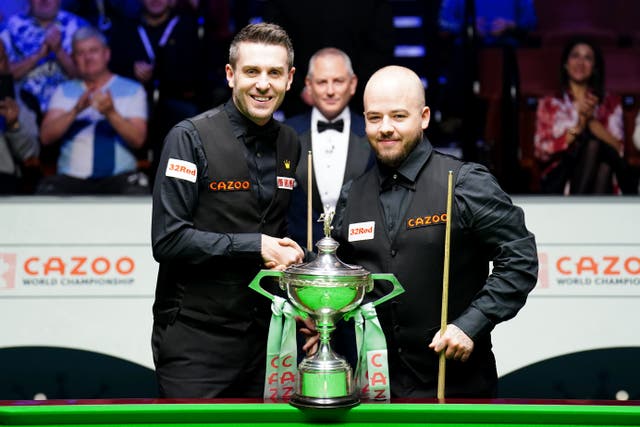 <p>Luca Brecel (right) was playing against Mark Selby in the World Snooker Championship </p>