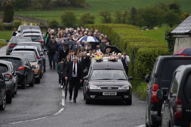 People attend a requiem mass for Julia McSorley at St Eugene’s Church, Glenock (Niall Carson/PA)
