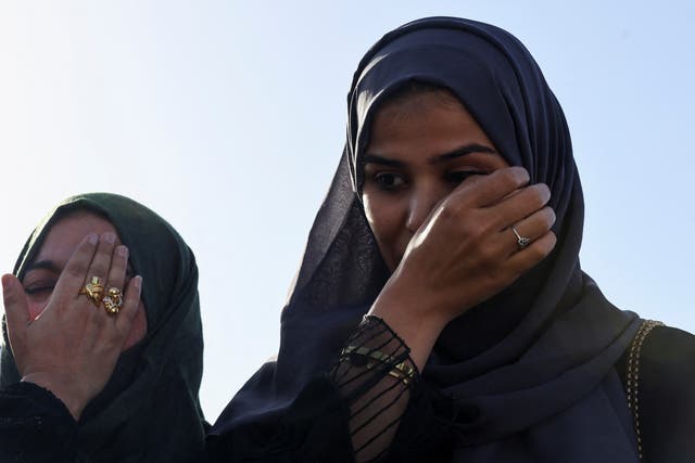 <p>Yamama Hasani Alhussein, right, who was evacuated from Sudan to escape the conflict, next to her mother Sahar as they arrives at Abu Dhabi airport</p>