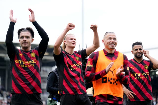 Manchester City’s Erling Haaland (second from left) celebrates with his team-mates after the 2-1 win at Fulham (John Walton/PA)