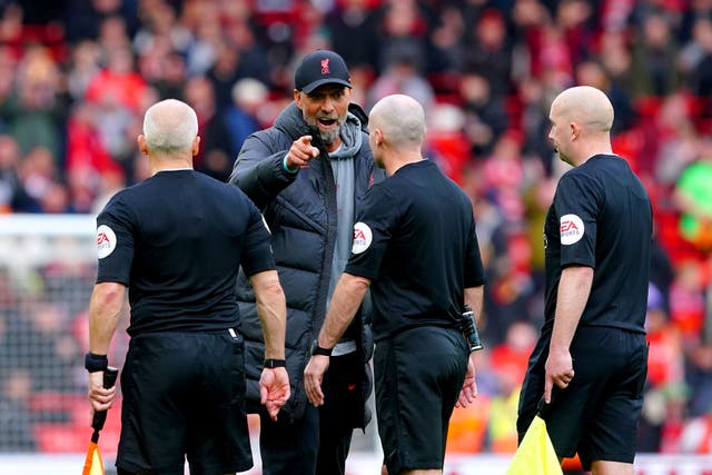 Jurgen Klopp accused referee Paul Tierney, second right, of unprofessionalism after Liverpool’s draw with Tottenham at Anfield (Peter Byrne/PA)