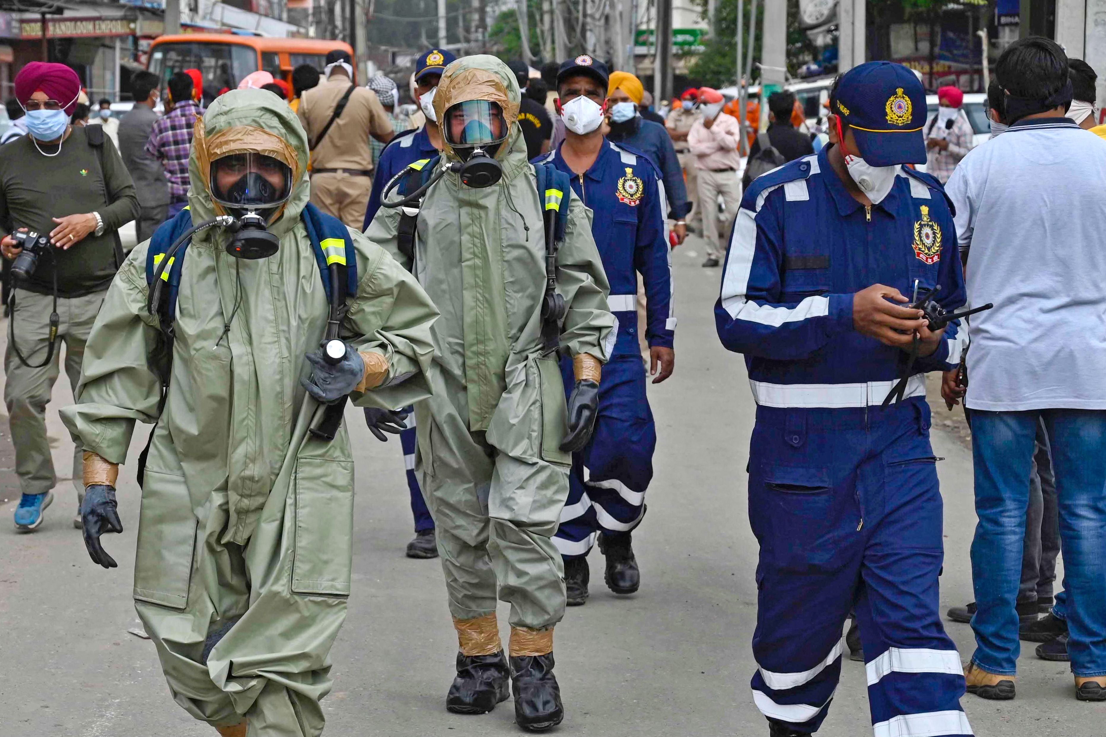 National Disaster Response Force (NDRF) personnel arrive to inspect the gas leak accident at a factory in Ludhiana, India