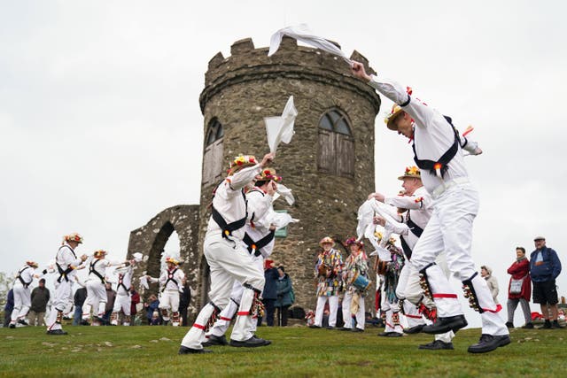 The Leicester Morris Men perform during the May Day dawn at Bradgate Park (Jacob King/PA)