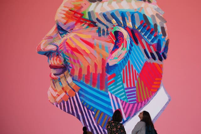 A digital portrait of the King is unveiled on the screens at Outernet, London (Yui Mok/PA)