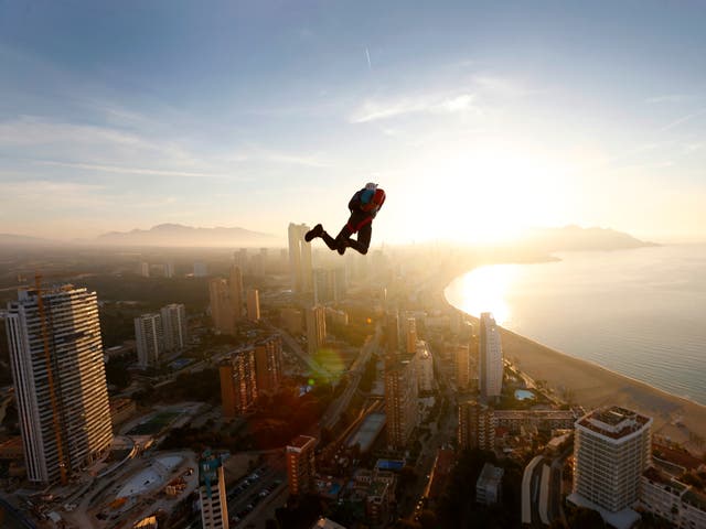 <p>A base jumper in action during the BASE Jump Extreme World Championship at Gran Hotel Bali in Benidorm, Spain</p>