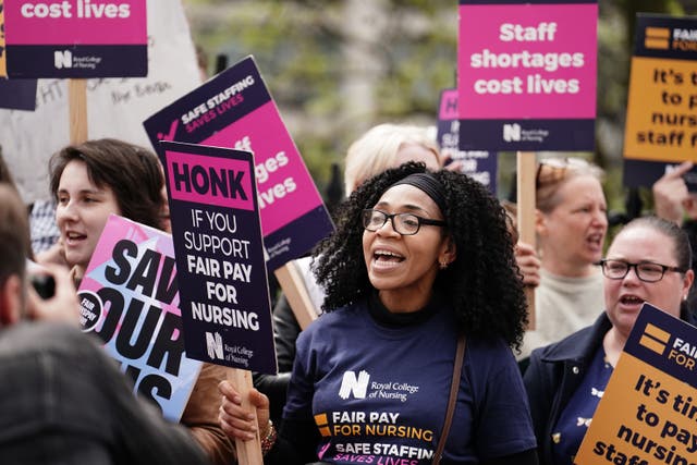 NHS workers on the picket line outside St Thomas’ Hospital, London, ahead of a march from the hospital to Trafalgar Square (/PA)