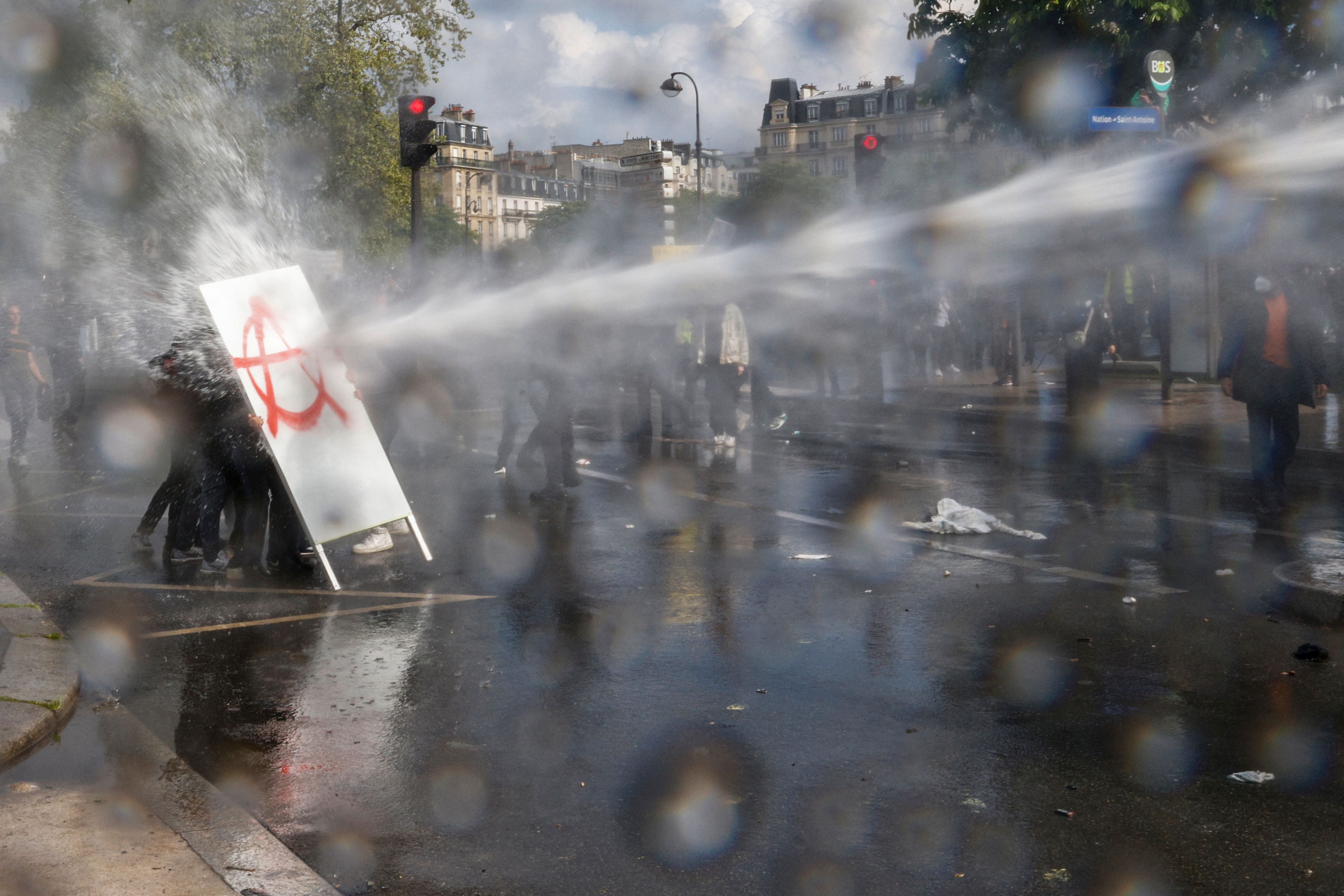 Protesters hit with a water cannon in Paris