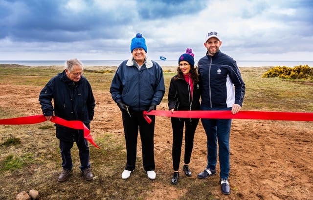 <p>Donald Trump with son Eric marks the start of work on a second course at his Menie golf resort in Aberdeenshire on Monday</p>