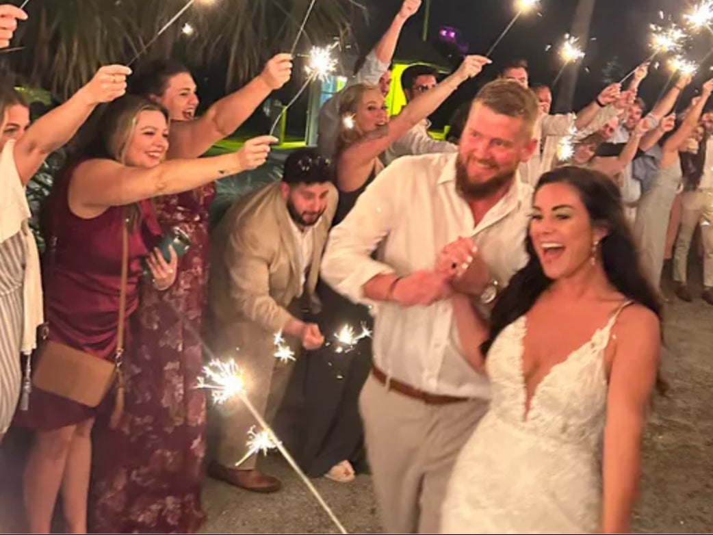 Aric Hutchinson and Samantha Miller at their wedding moments before the crash