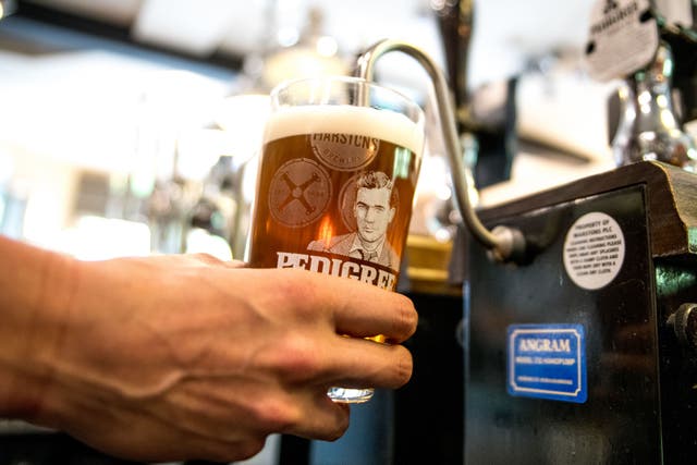 A person pouring a pint. Pubs are set to receive a £120 million boost from extra demand over the Coronation weekend (Carlsberg Marston’s Brewing/PA)