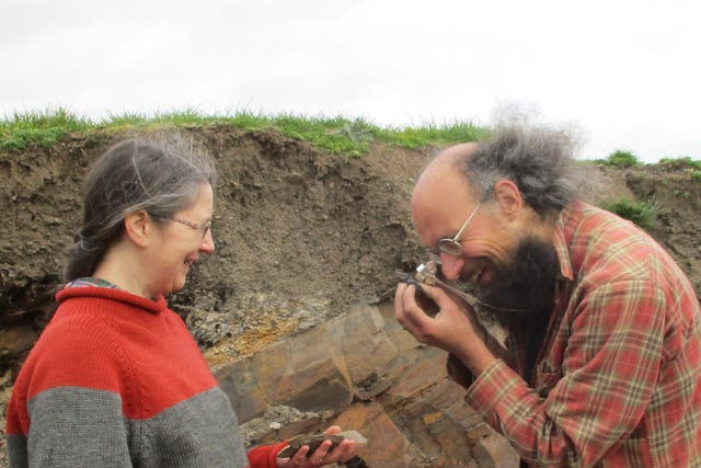 <p>Lucy Muir and Joe Botting examining a specimen at the Castle Bank Quarry</p>