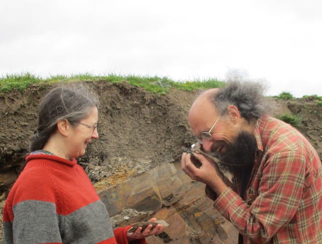 <p>Lucy Muir and Joe Botting examining a specimen at the Castle Bank Quarry</p>