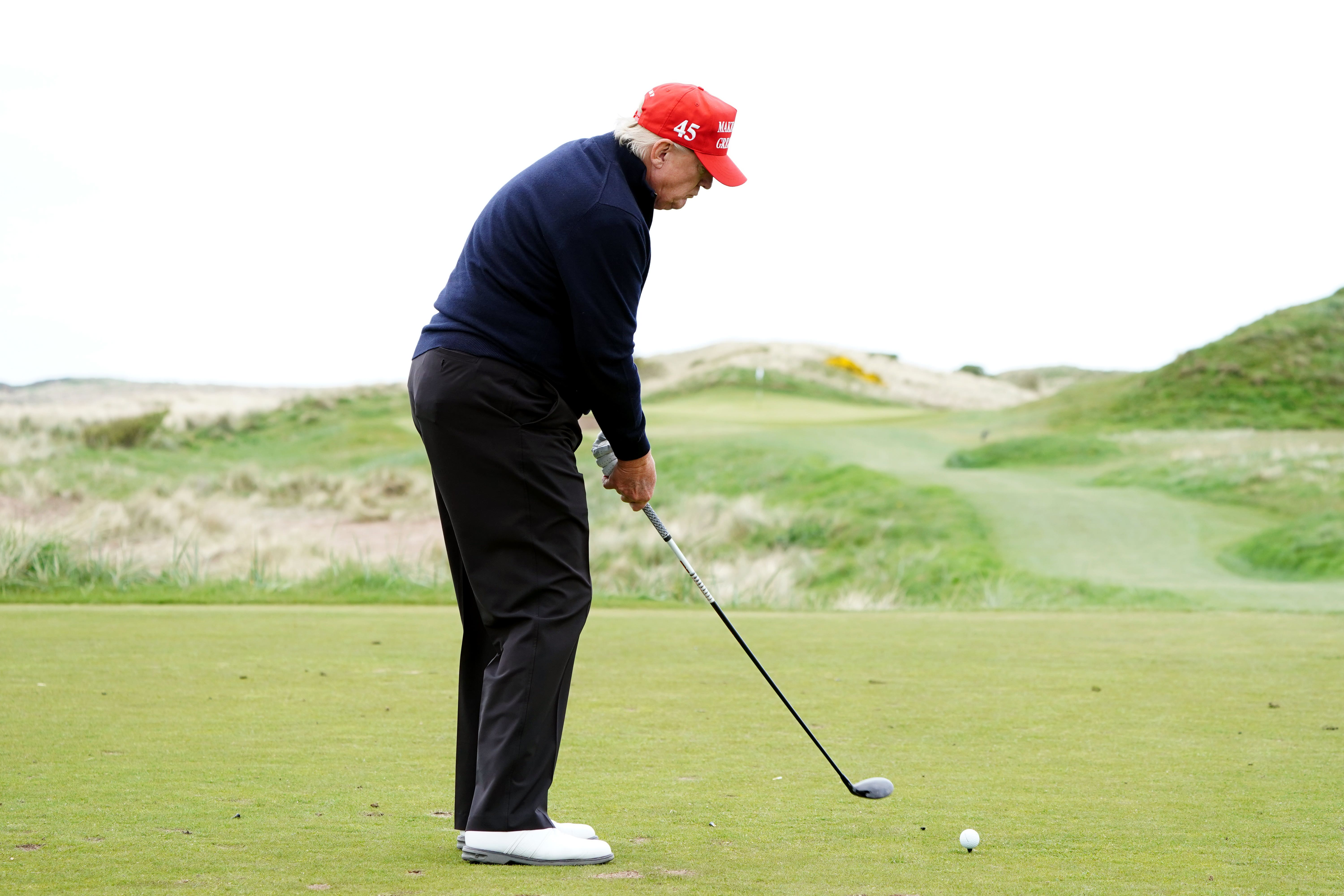 Donald Trump plays golf at his Turnberry course during Scottish visit