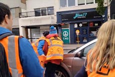 Moment motorist drives through Just Stop Oil protesters blocking road and ‘runs over woman’s foot’