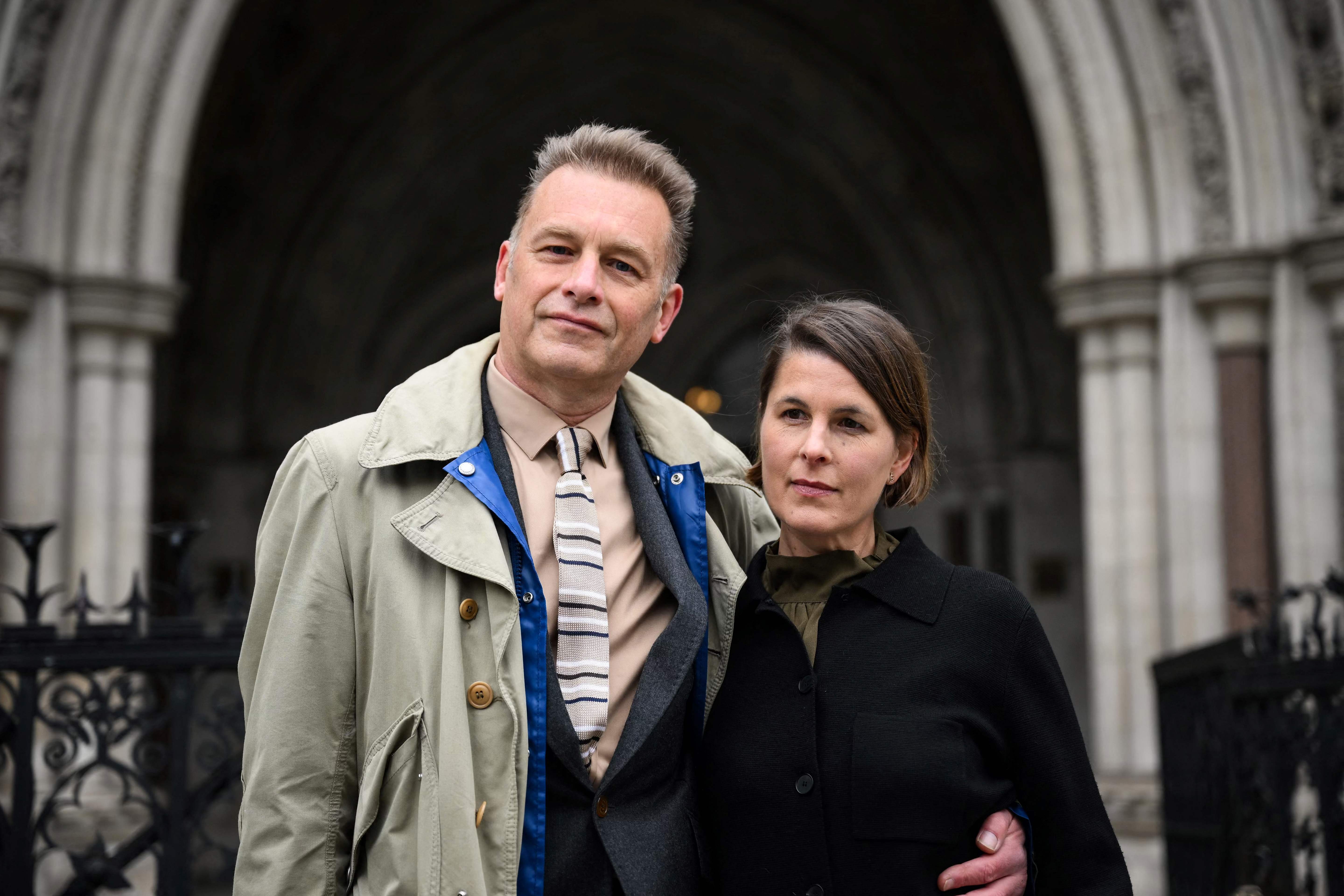 Chris Packham poses with partner Charlotte Corney outide the High Court in London