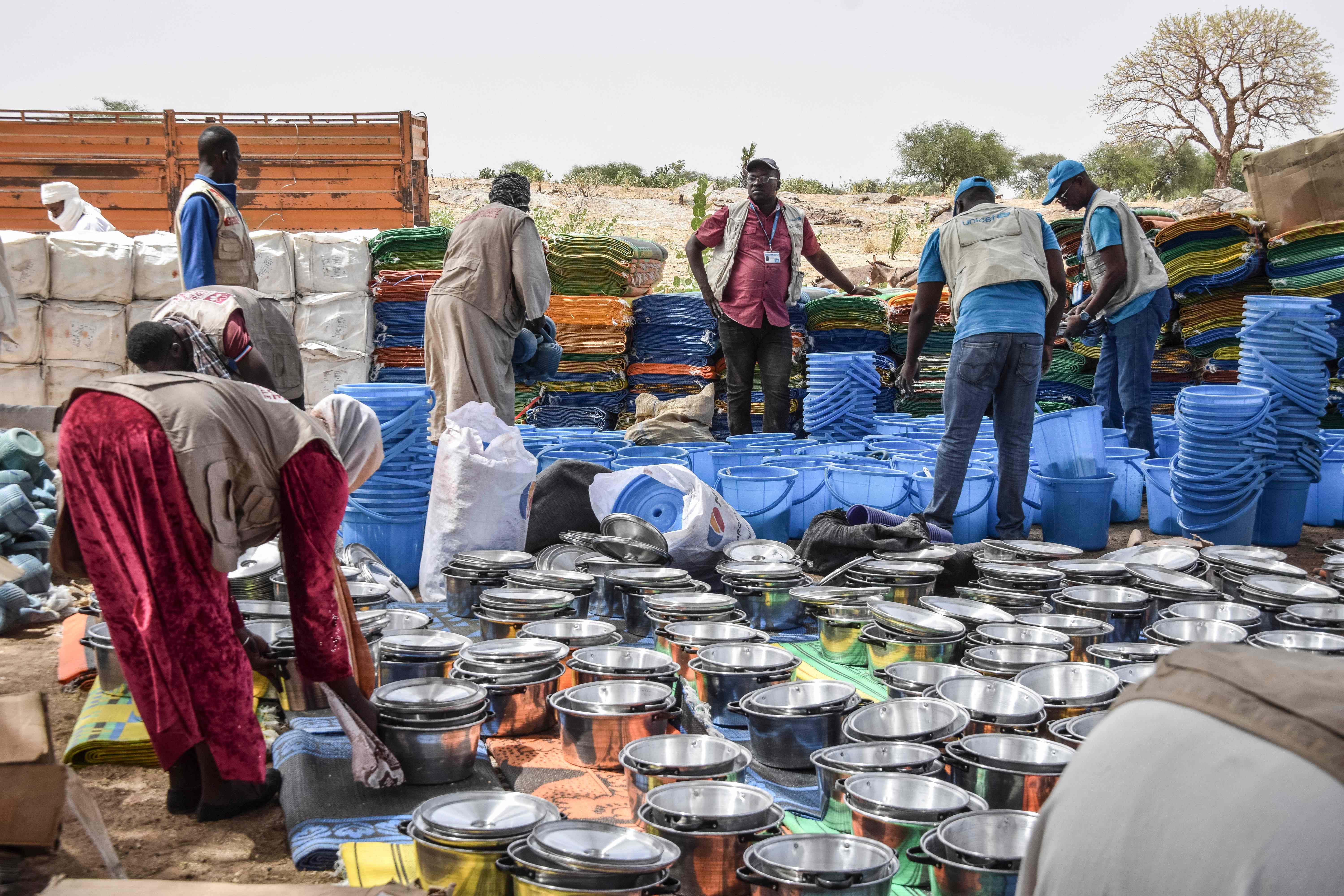 Personnel from the United Nations Children’s Fund (UNICEF) prepare aid kits for Sudanese refugees from the Tandelti area who crossed into Chad, in Koufroun, near Echbara, on April 30, 2023