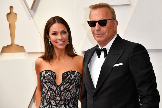 <p>Kevin Costner and his wife Christine Baumgartner at the Oscars in 2022</p>