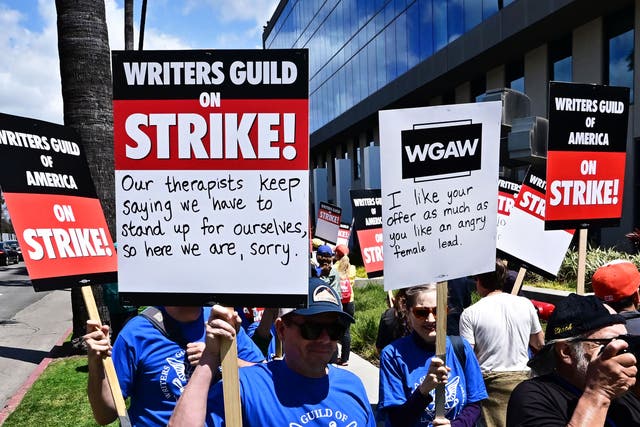 <p>Writers picket in front of Netflix on Sunset Boulevard in Hollywood, California, on 2 May</p>