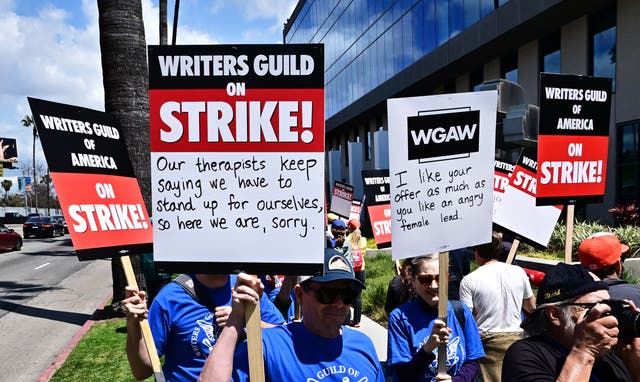<p>Writers picket in front of Netflix on Sunset Boulevard in Hollywood, California, on 2 May</p>