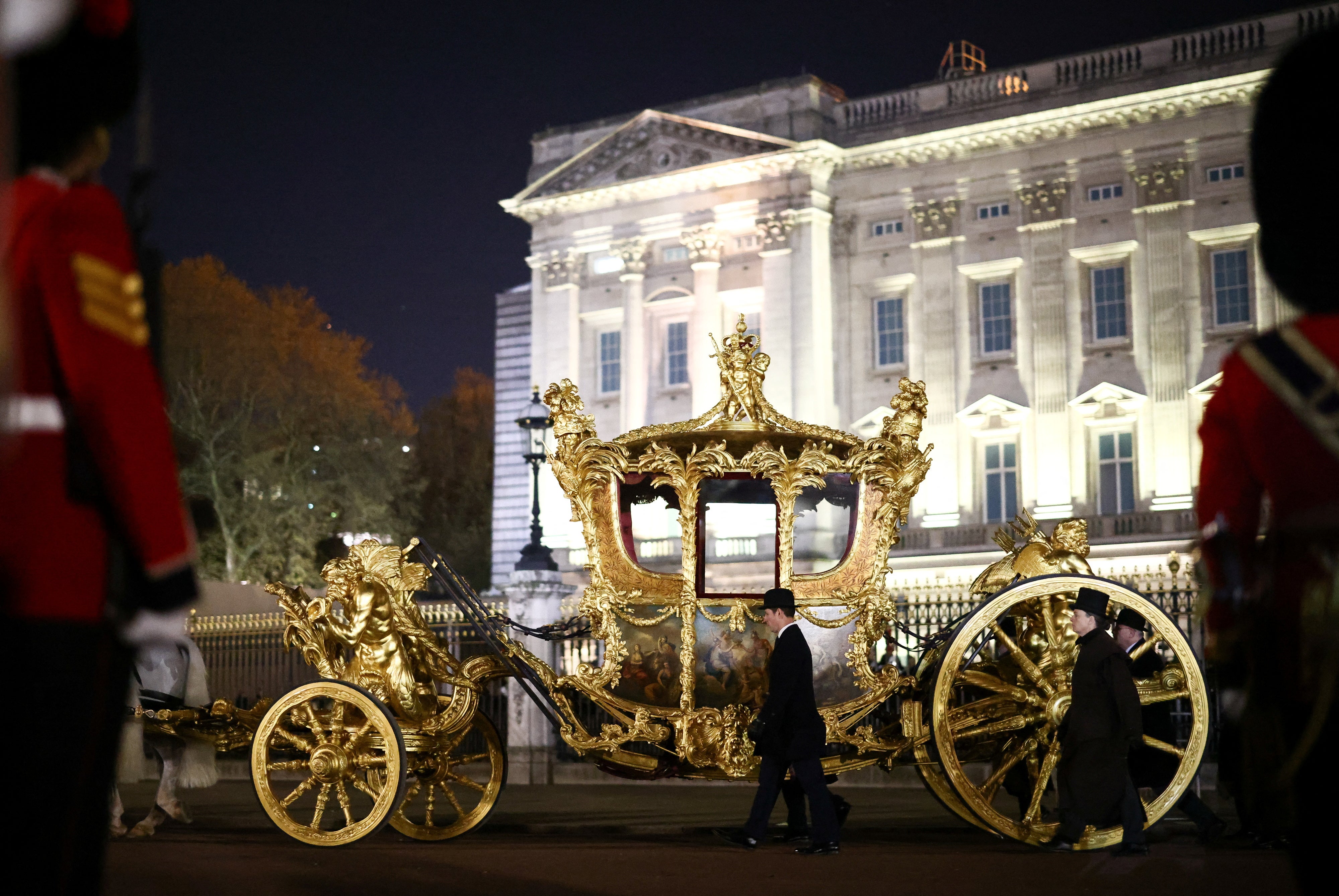 The Gold State Coach is ridden alongside members of the military during a full overnight dress rehearsal of the coronation