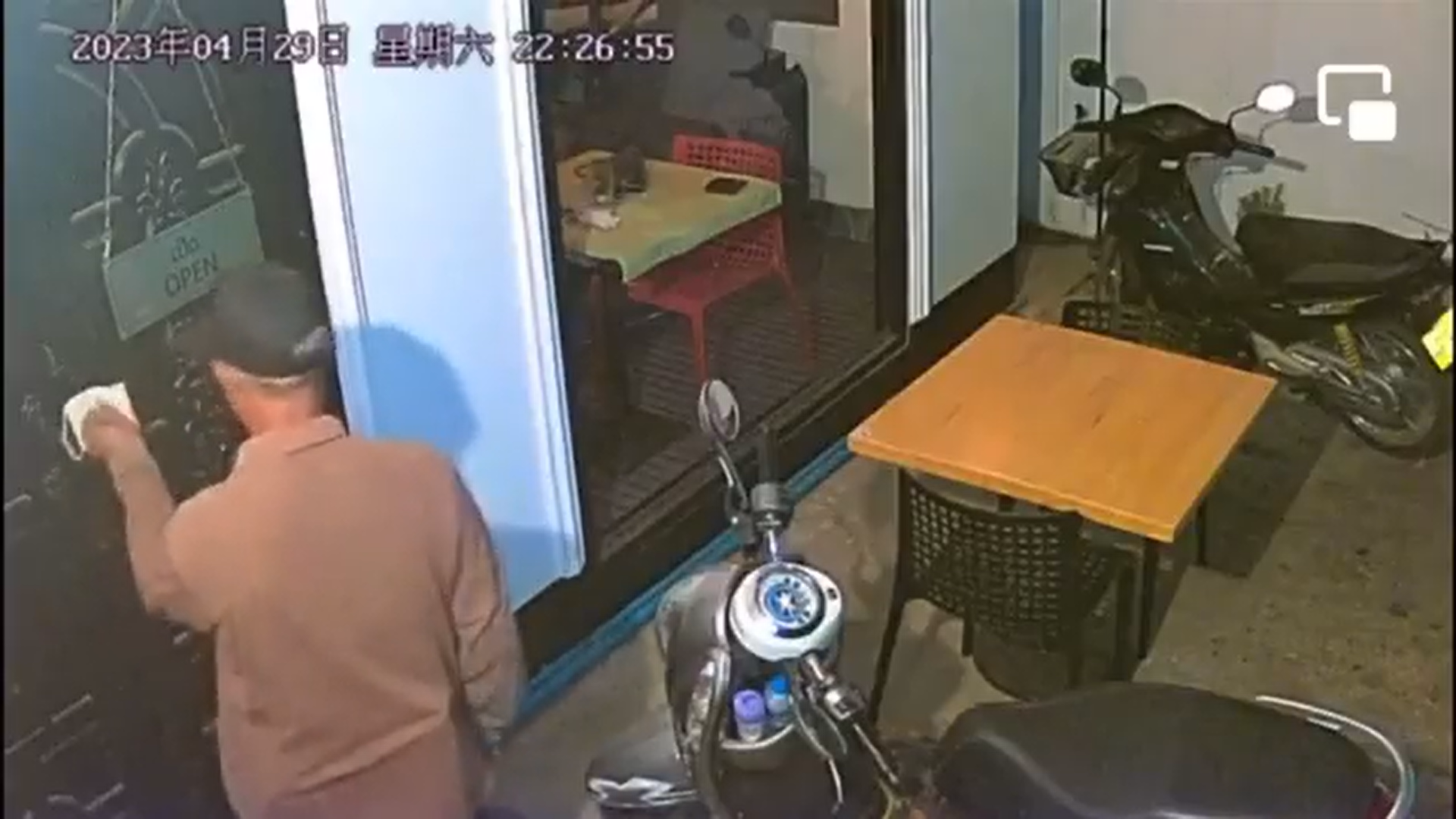 A screengrab from the CCTV footage from outside the coffee shop shows the gunman who shot down Anousa Luangsuphom