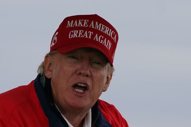 <p>Former US president Donald Trump playing golf at his Trump Turnberry course in South Ayrshire (Andrew Milligan/PA)</p>