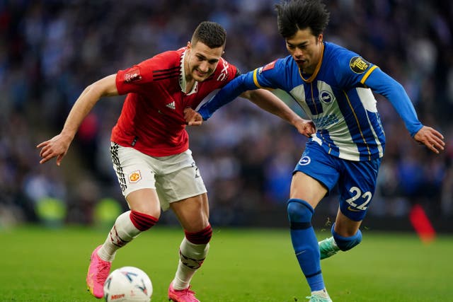 Kaoru Mitoma, right, and Brighton suffered Wembley disappointment against Manchester United (Mike Egerton/PA)