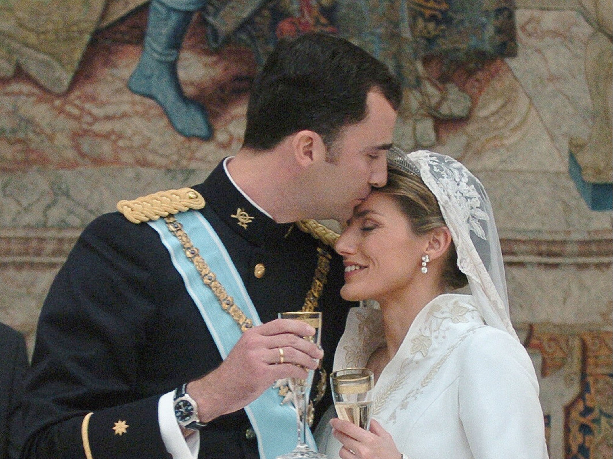 Prince Felipe kisses Letizia Ortiz on their wedding day on 22 May 2004