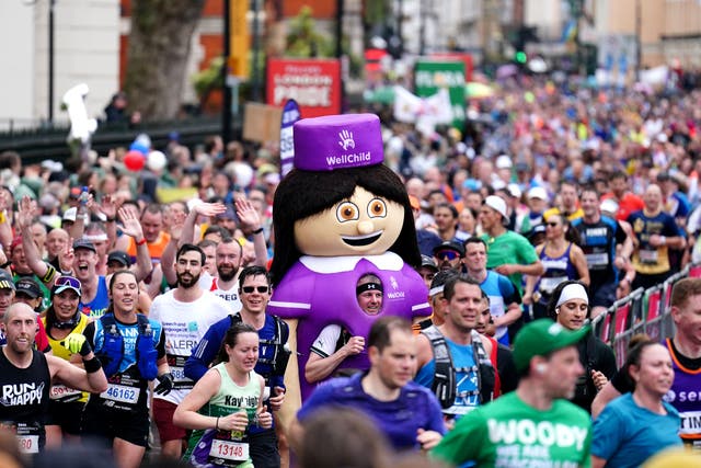 Participants run past the Cutty Sark in Greenwich during the TCS London Marathon (Zac Goodwin/PA)