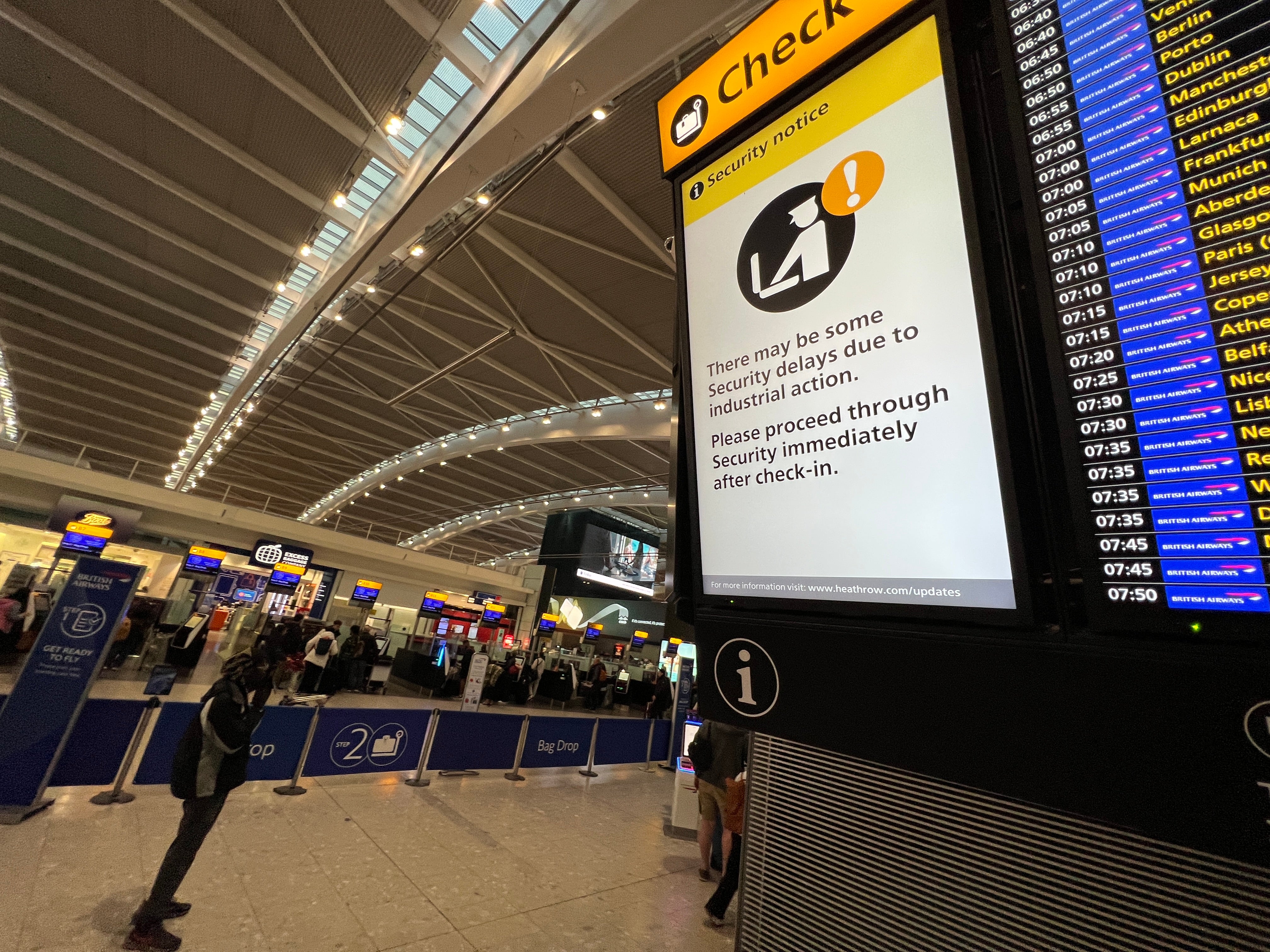 Go slow? Signs at Heathrow airport Terminal 5 warn of possible delays at security during a previous strike