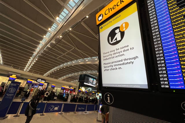 <p>Go slow? Signs at Heathrow airport Terminal 5 warn of possible delays at security</p>