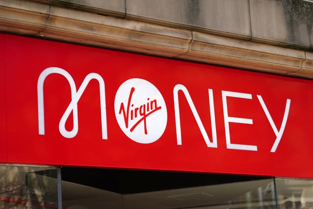 Virgin Money has reported shrinking profits as it cautioned over a jump in borrowers defaulting (PA)