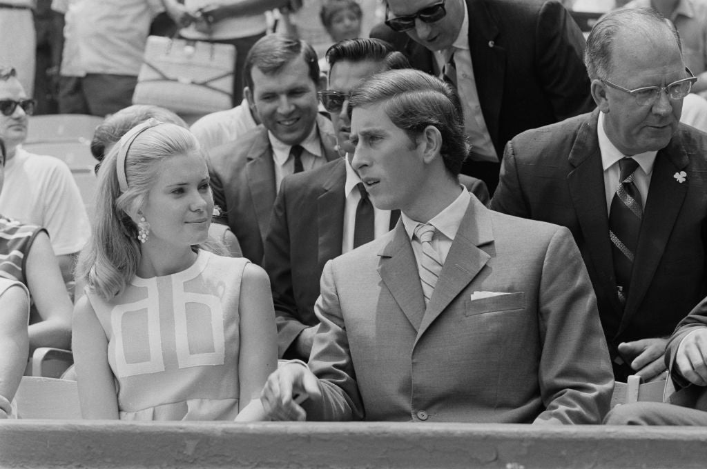 Prince Charles sits with Tricia Nixon, daughter of the American President, during a baseball game at RFK Stadium in 1970