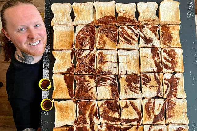 Nathan Wyburn with his Marmite and toasted white bread portrait of The King. (Credit/Nathan Wyburn/PA)