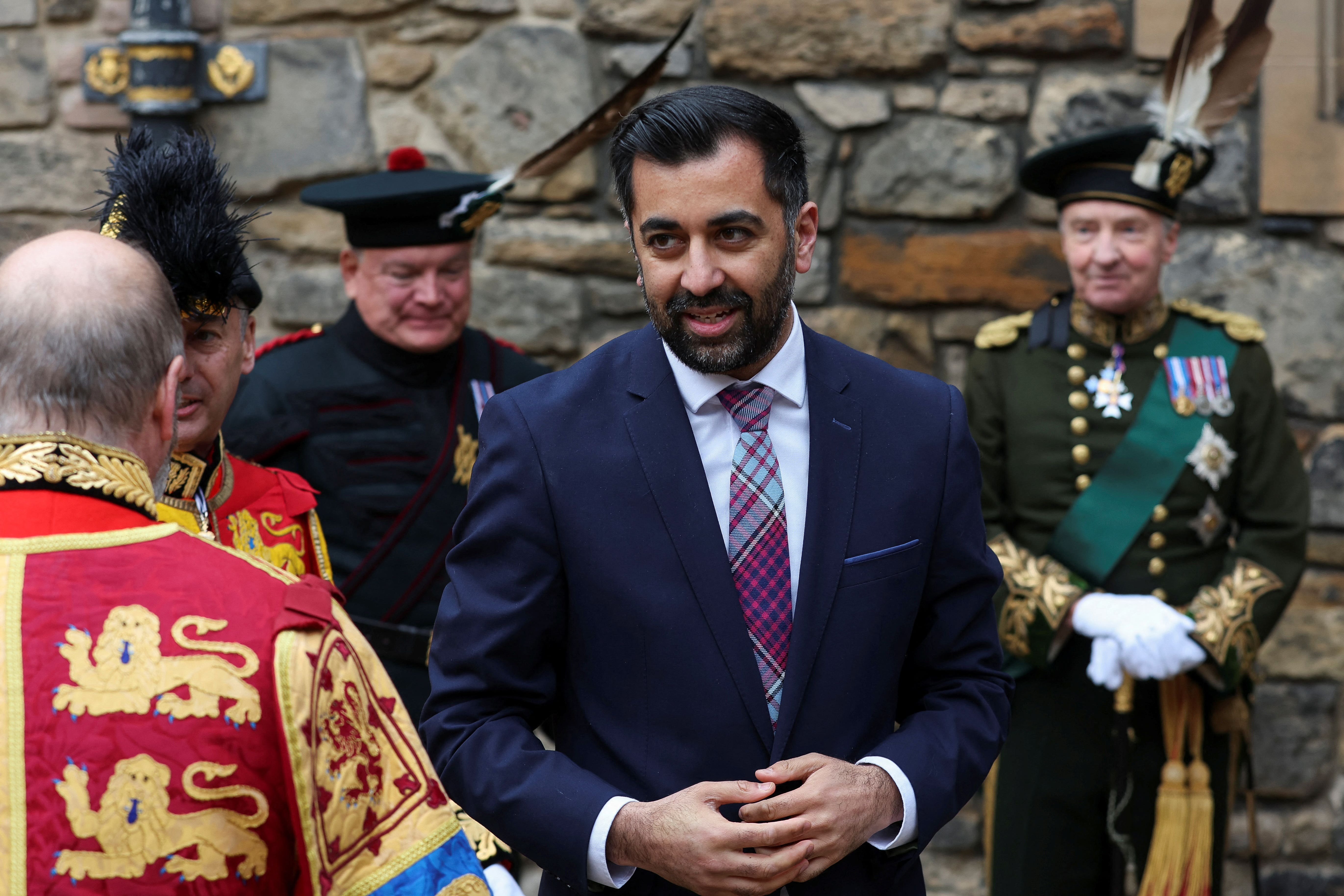 Humza Yousaf will attend the coronation with his wife Nadia El-Nakla (Russell Cheyne/PA)