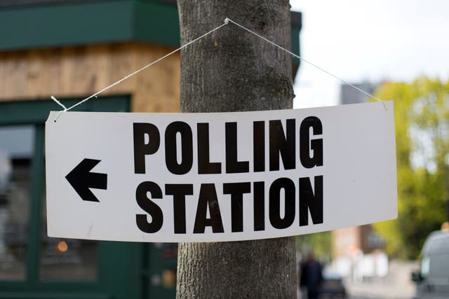 A polling station sign (PA)