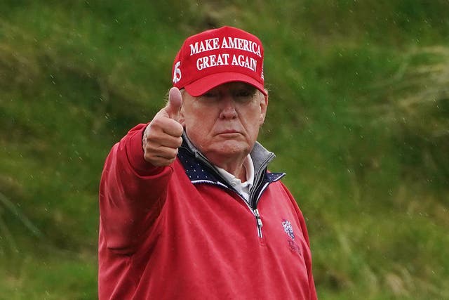 Former US president Donald Trump on the 15th green (Brian Lawless/PA)