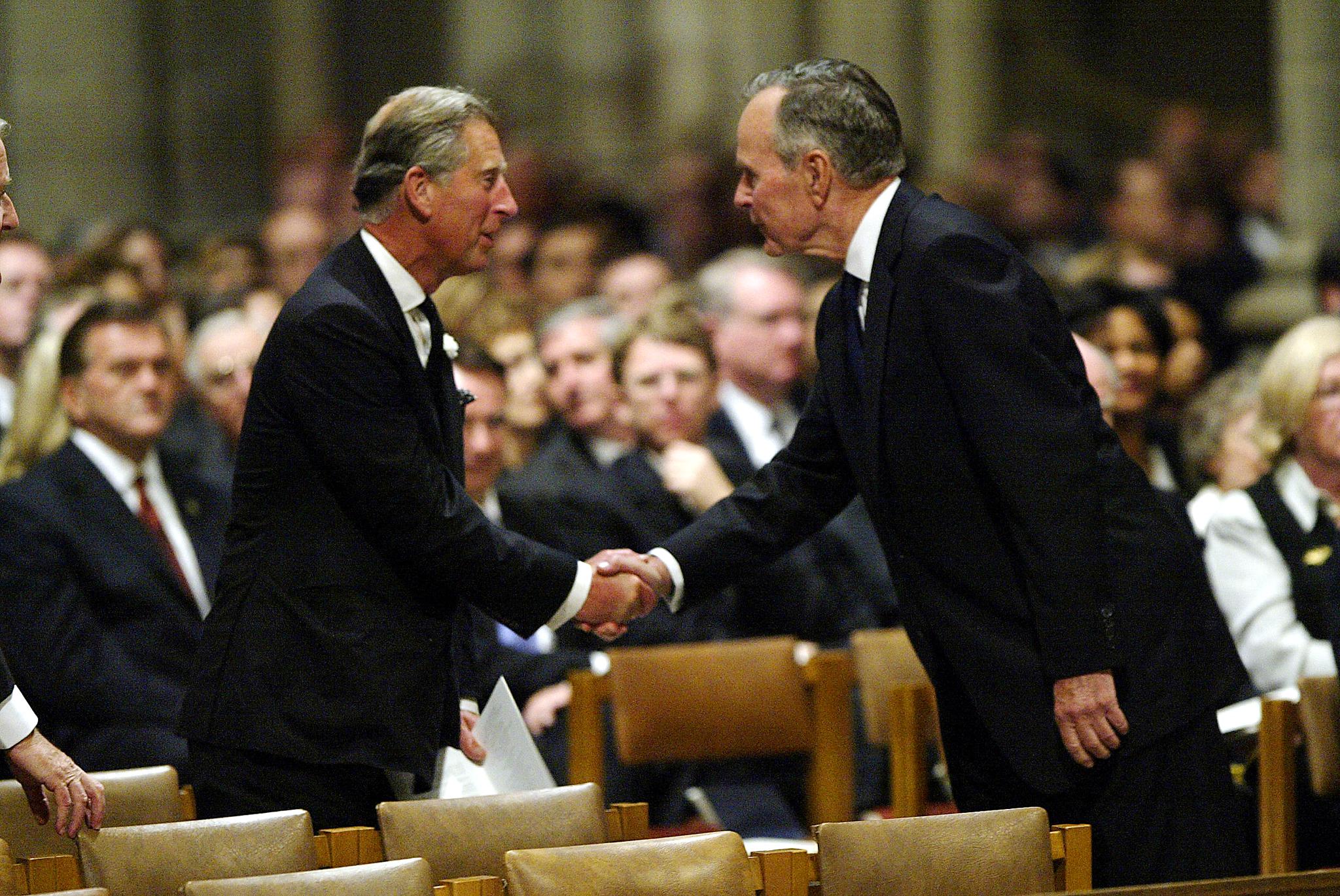 Former US president George HW Bush greets Prince Charles at the funeral of Ronald Reagan in Washington, DC in June 2004