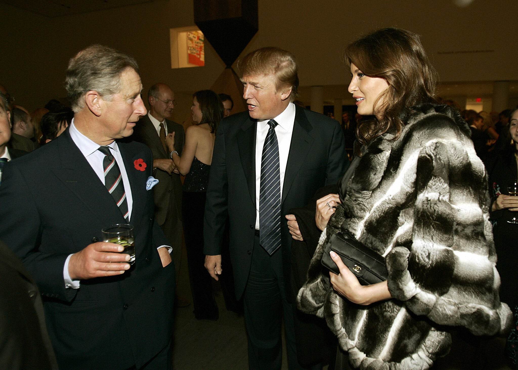 Prince Charles speaks to a future US president and first lady –?Donald and Melania Trump – at the Museum of Modern Art in New York in 2005