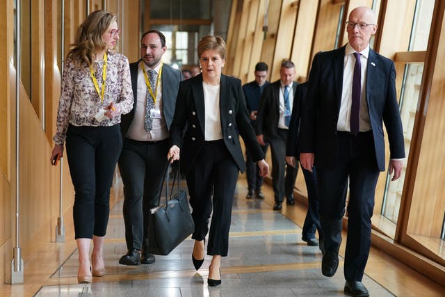 Former Scottish first minister Nicola Sturgeon makes her way to the main chamber of the Scottish Parliament in Edinburgh (Andrew Milligan/PA)