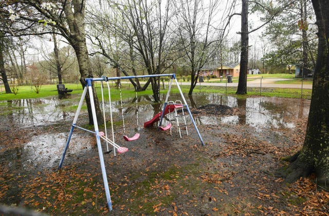 <p>Heavy rains flood the front yard of Lowndes County resident Charlie Mae Holcombe, Feb. 21, 2019, in Hayneville, Alabama. The Department of Justice on Thursday said an environmental justice probe found Alabama engaged in a pattern of inaction and neglect regarding the risks of raw sewage for residents in the impoverished Alabama county and announced a settlement agreement with the state</p>