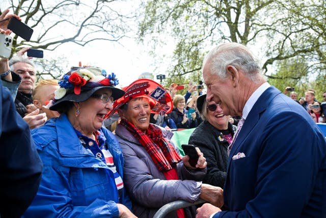 The King on a walkabout outside Buckingham Palace, London (Toby Melville/PA)